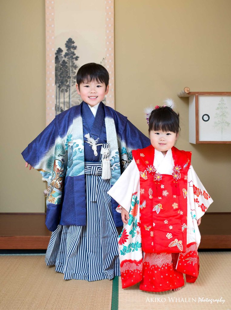 boy and girl in kimonos in Japanese Room, celebrating Shichi Go San,