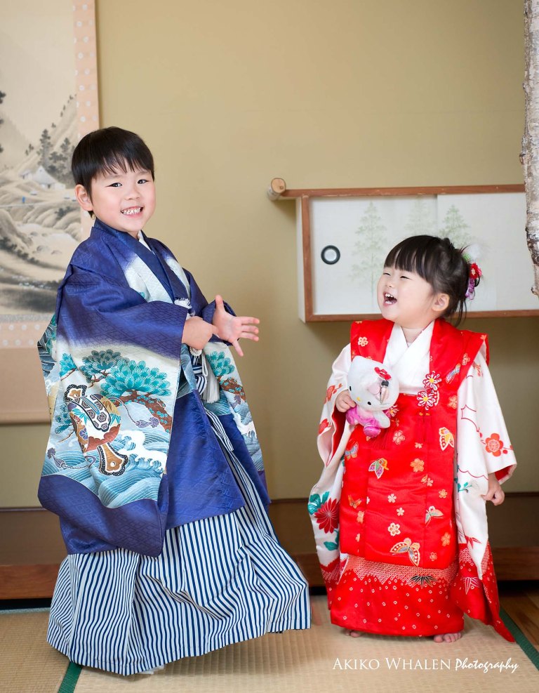 boy and girl in kimonos in Japanese Room, celebrating Shichi Go San,